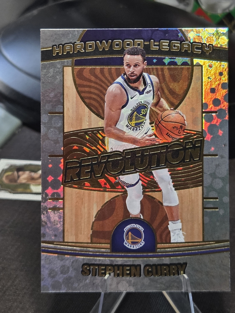 2024 Panini Revolution "Hardwood Legacy" trading card featuring Stephen Curry..